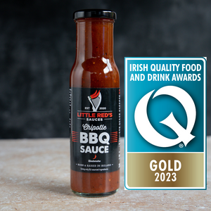 A Bottle of Little Red's Award-Winning Chipotle BBQ Sauce alongside the Irish Quality Food and Drink Gold Award 