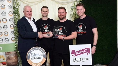 Shane accepting the 2022 Gold award with fellow attendees