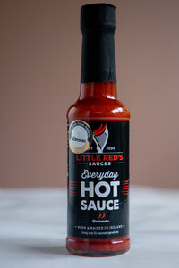 Little Red's Everyday Hot Sauce with Gold Blas na hEireann Award sticker on a 250ml bottle, showcasing vibrant red sauce visible through clear glass. The label highlights the award, emphasizing the sauce's premium quality and distinct Irish flavor profile, ideal for daily culinary adventures